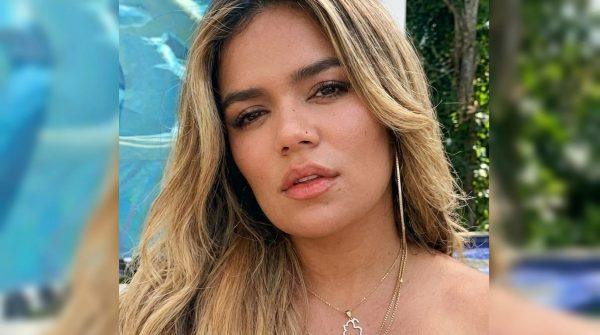 Karol G's feathered tour outfits draw PETA Latino's criticism